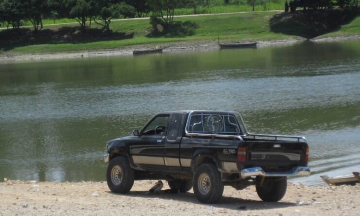 A Complete Guide to Buy Used Toyota Trucks for Sale in Houston 4 old tacoma next to the water